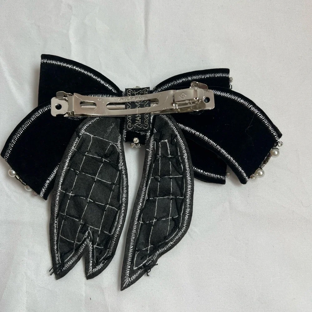 Elegant Black and Silver Bow Accessory